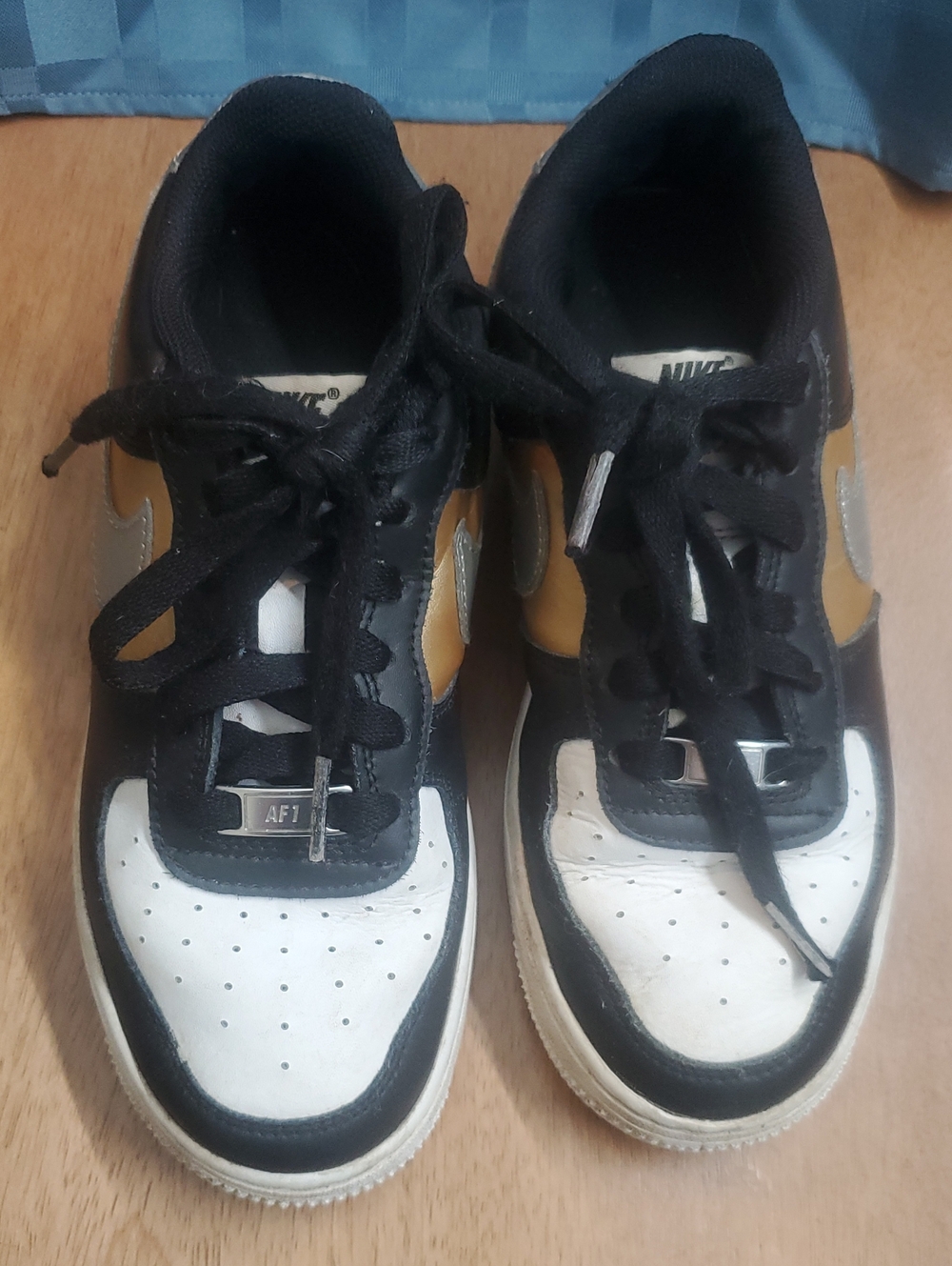 Nike Air Force 1 Low Sneakers in Black, White & Gold